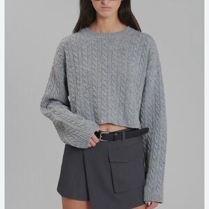 Cropped cable knit sweater